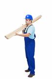 Worker carries wooden planks