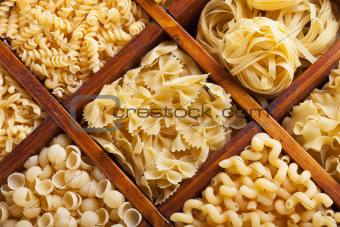 Assorted pasta in wooden compartments