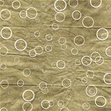 Old crumpled golden paper background with circles