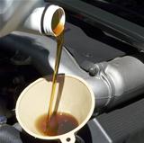 Adding Oil to Car Closeup
