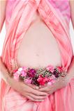 Pregnant woman's belly with flowers