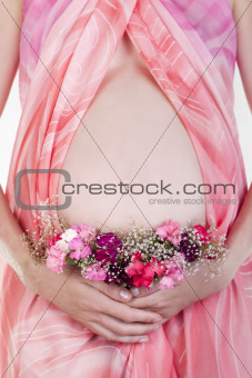 Pregnant woman's belly with flowers