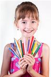 Young girl with pencils on white background