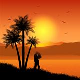 Kissing couple in tropical landscape