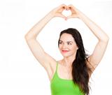 Beautiful woman forming love heart with hands