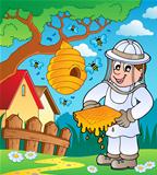 Beekeeper with hive and bees