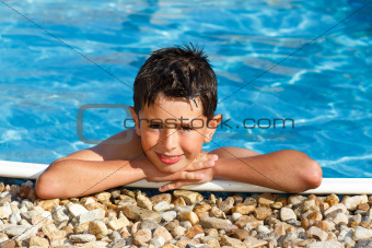 smiling boy in the swimming pool 