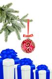 Christmas ball on the tree and gift boxes on white background