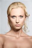Portrait of pretty blonde woman with serious expression