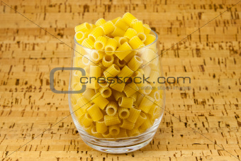 Ditalini pasta inside transparent glass