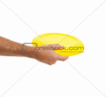 Closeup on flying disc in male hand isolated on white