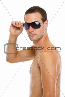 Portrait of young guy in sunglasses