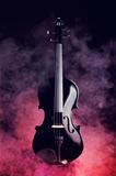 Elegant black violin in smoke 