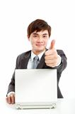 successful businessman working with computer and showing thumb up