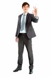 full length of smart  Businessman with ok gesture