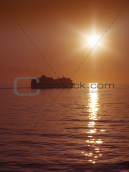sunset and cruise ship