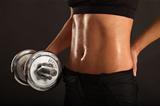 Female lifting a dumbbell