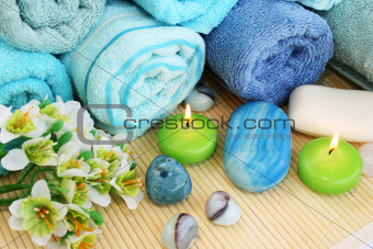 Towels, soaps, flower, candles