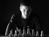 Teenager boy playing chess
