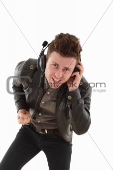 Young adult male louding and listening music
