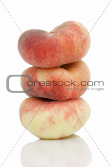 Saturn or donut peaches isolated on white background