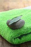 green towel, stone and leaf Zen Concept