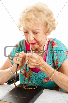 Senior Woman Saying the Rosary