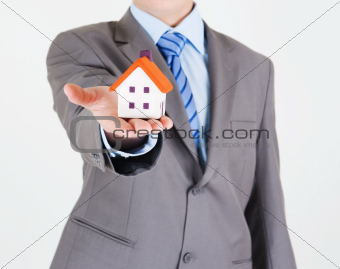 Businessman with a house
