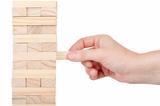 Wooden blocks tower and a hand