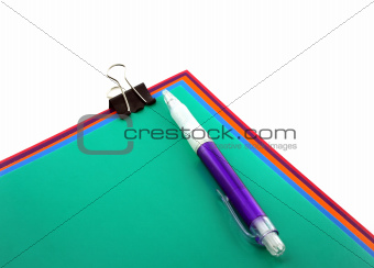 Color papers, black clip and pen