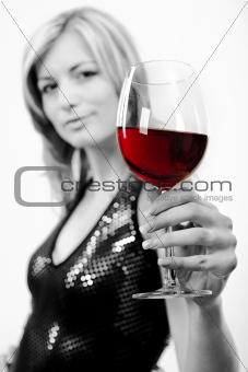 Young woman with glass of red wine