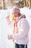 Girl About To Throw Snowball In Snowy Woodland