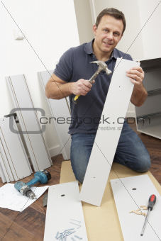 Man Assembling Flat Pack Furniture