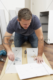 Man Assembling Flat Pack Furniture