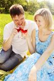 couple in meadow with wine