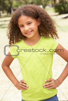 Portrait Of Happy Young Girl In Park
