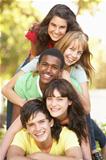 Group Of Teenagers Piled Up In Park