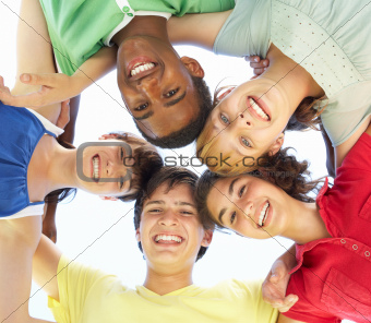 Group Of Teenagers Looking Down Into Camera