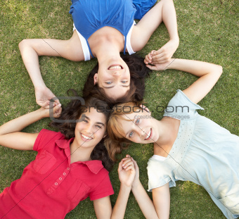 Group Of Teenager Girls Looking Up Into Camera