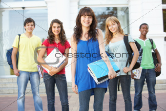 Group Of Teenage Students Standing Outside College Building