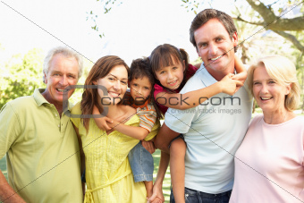 Extended Group Portrait Of Family Enjoying Day In Park