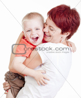 happy mother holding her little son smiling