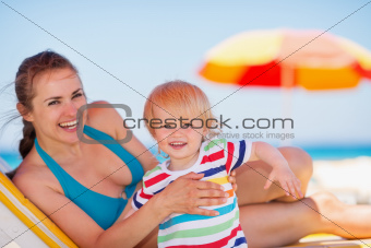 Portrait of mother and baby on beach