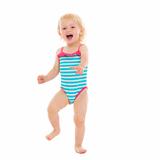 Portrait of cheerful baby in swimsuit