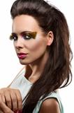 pretty brunette with feathered makeup looks in to the lens