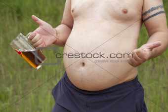 Fat man with a beer in hand