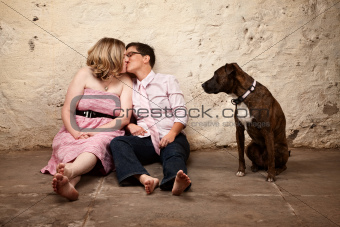 Women Kissing with Dog Nearby