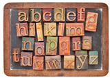 letterpress alphabet on balckboard