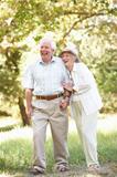 Senior Couple Walking In Park