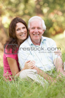 Senior Man With Adult Daughter In Park